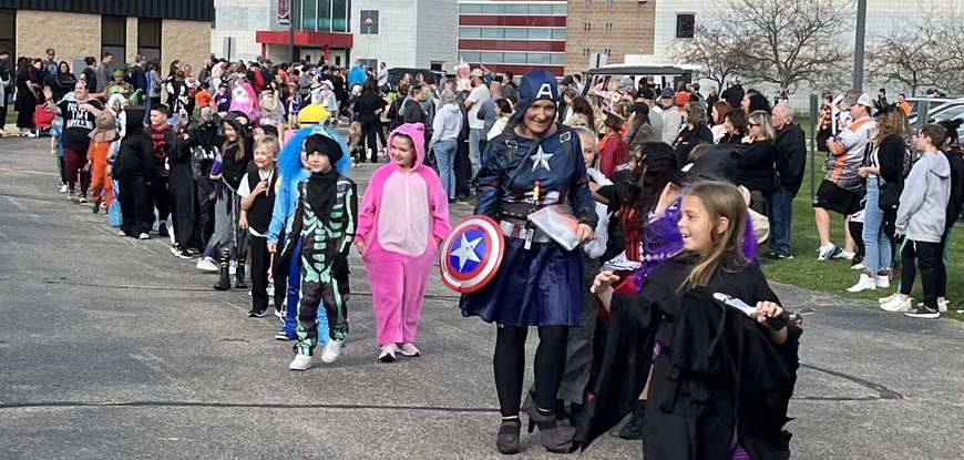 KIDS IN COSTUMES WALKING IN PARADE